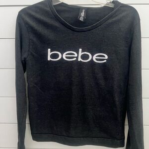 bebe‎ crop top
Black long sleeve shirt with with logo on front
Size medium